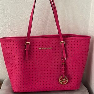 Pink purse with holes